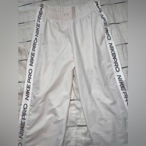 Nike pro snap on track pants. White/off white color. Size XS